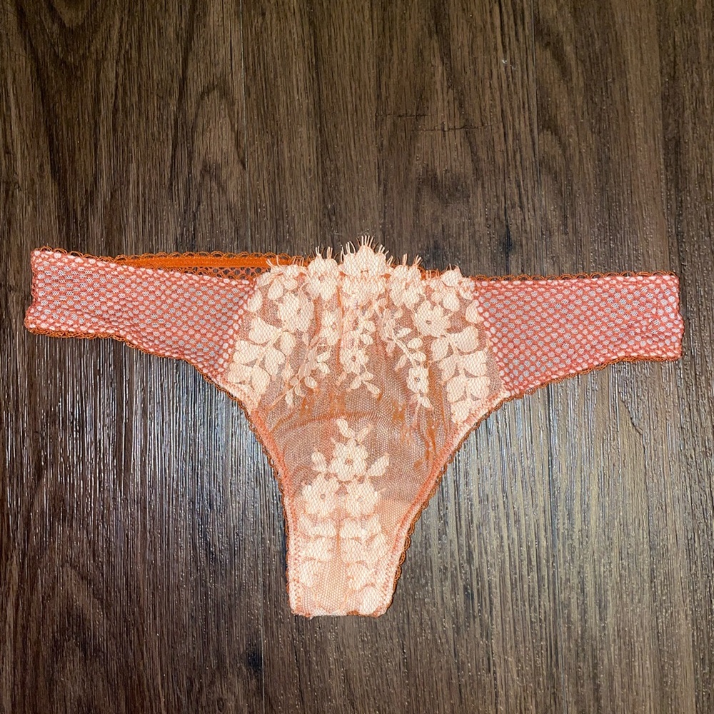 NWOT Victoria’s Secret thong women’s size medium. Orange lace thong